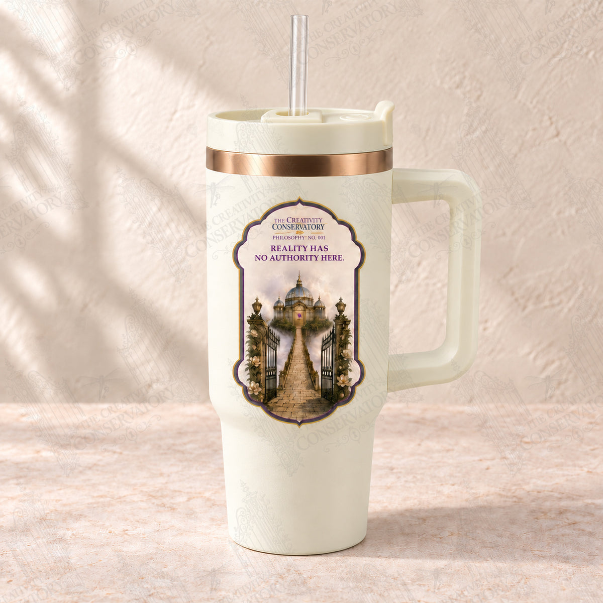 Reality Has No Authority Here on bronze-plated cream handled tumbler with clear reusable straw; faint diagonal Wondergate watermark across the entire image