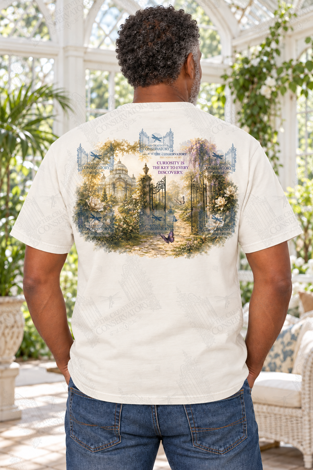 Mature Black man modeling the Philosophy Landscapes with Pocket Motifs Curiosity design on the back; faint diagonal Wondergate watermark across the entire image