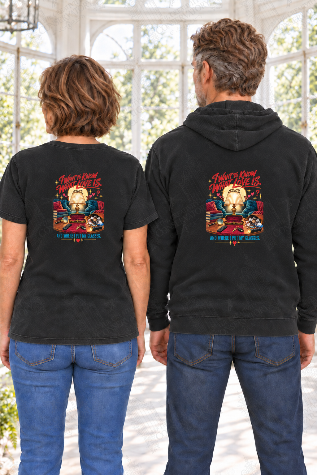 I Want to Know What Love Is—and Where I Put My Glasses — back print on approved middle-aged T-shirt and hoodie models; proportional 10-inch-wide artwork; faint diagonal Wondergate watermark across the entire image